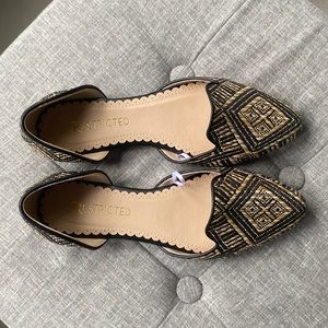 Black and tan woven flats. Size 7. Never worn.